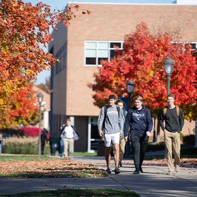 Students walking outside on campus.