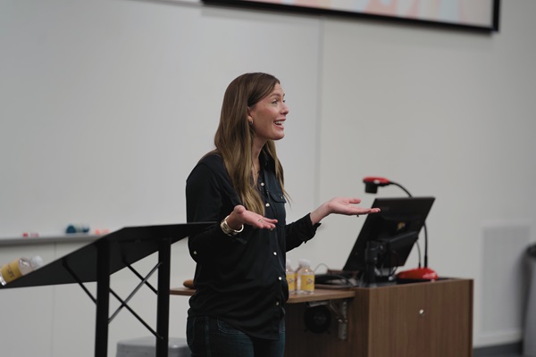 Women speaking in front of an audience