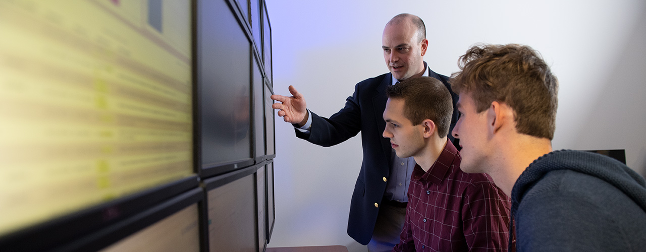 Dr. Seth Hamman instructing cybersecurity students