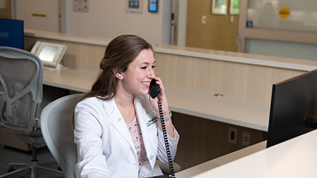 Desk receptionist on phone