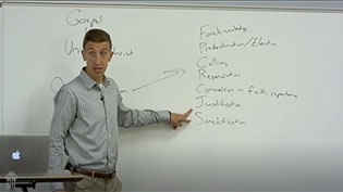 Dr Kimble teaching Theology I in a lecture hall.