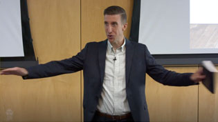 Dr. Kimble teaching Theology II in a lecture hall.