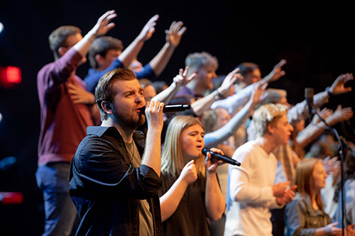 Group of people singing.