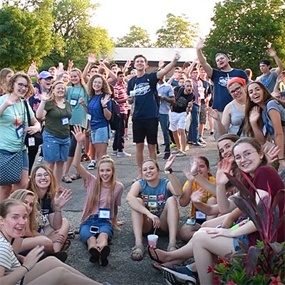 Group of students waving.
