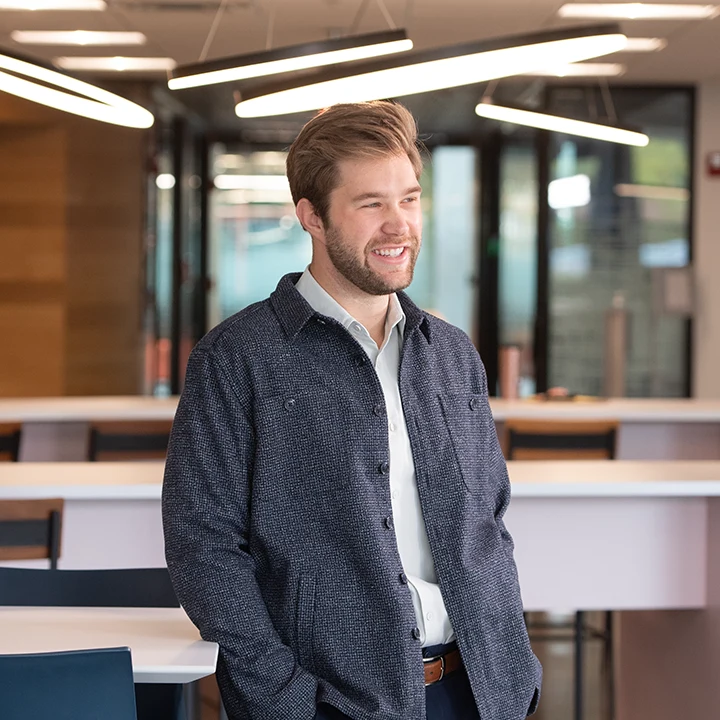 Photo of man standing in a classroom