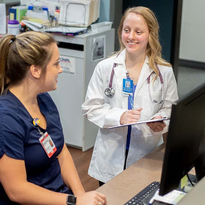 Nursing staff reviewing charts.